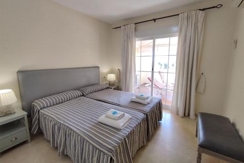 Posteľ alebo postele v izbe v ubytovaní Apartamento Puertosol