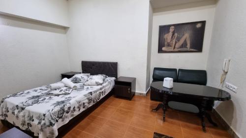 Llit o llits en una habitació de Sv Hotel