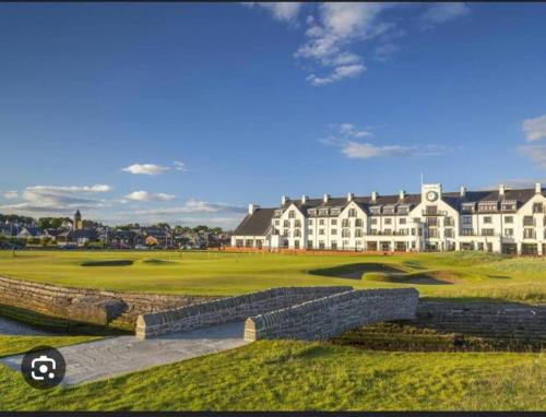 a view of a golf course with a large building at A glimpse of the championship in Carnoustie