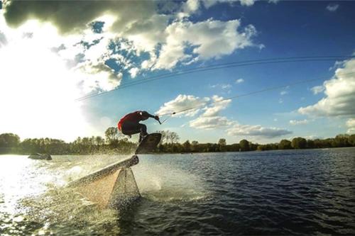 a person on a wake board in the water at Villa June Rosy in Wijchen