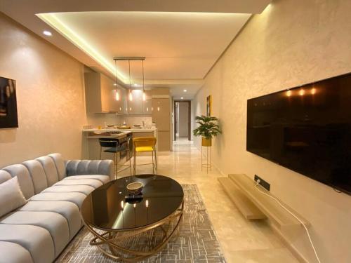 a living room with a couch and a table at Glamorous Habous - By AppartAli in Casablanca