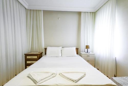 Postel nebo postele na pokoji v ubytování Flat with Balcony 5 min to Omi Beach