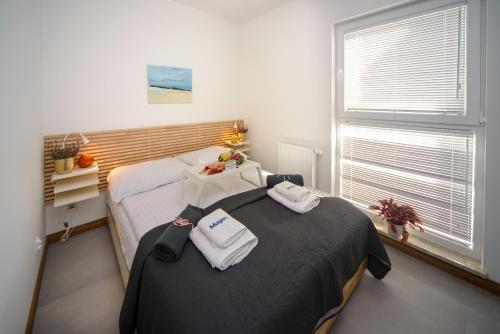 Ένα ή περισσότερα κρεβάτια σε δωμάτιο στο Maya's Flats & Resorts 103 - PCK