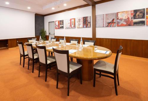 a conference room with a long table and chairs at Best Western Gorizia Palace in Gorizia