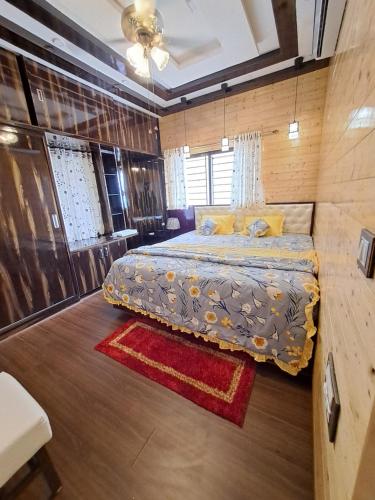 Ліжко або ліжка в номері Kshetra Manipal
