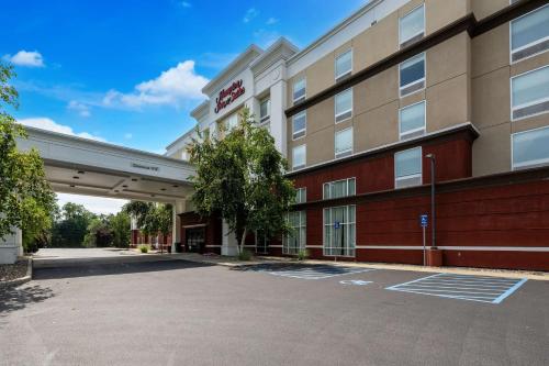 a rendering of the front of a hotel with a parking lot at Hampton Inn & Suites Poughkeepsie in Spackenkill