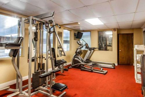 a gym with several tread machines in a room at Wingate by Wyndham Marietta Conference Center Ohio in Marietta