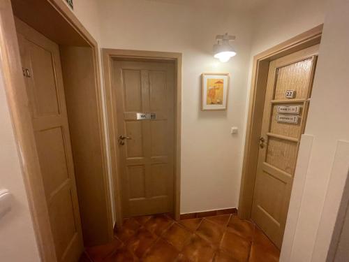 a hallway with a door and a hallwayngth at Chata Dorotka Kvilda in Kvilda
