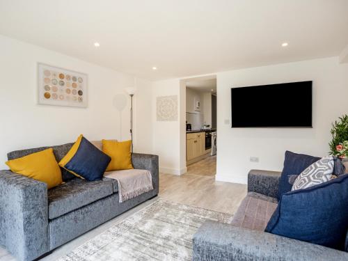 a living room with a couch and a flat screen tv at Outstanding 6 Sleeper - Great Location - Legoland in Windsor