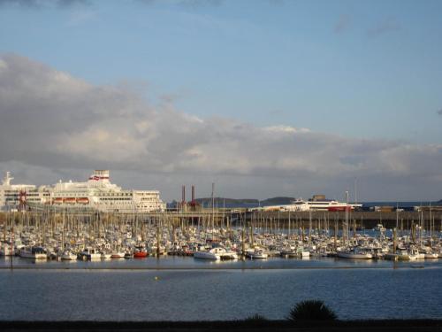 a bunch of boats are docked in a harbor at Manoir Du Cunningham in Saint Malo