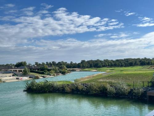 a view of a river from a bridge at Pri jazere - Golf rezort in Hrubá Borša