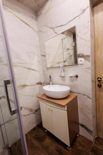 a bathroom with a sink and a mirror at Dream Hotel in Haghpat