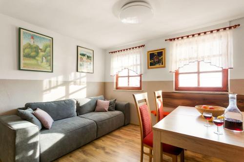 a living room with a couch and a table at Holiday Home Tramte In Vineyards - Happy Rentals in Škocjan
