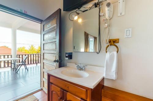 a bathroom with a sink and a mirror at Isebei Guest House Gold Standard Certified in Hopkins