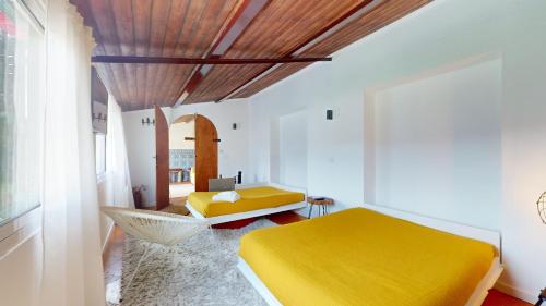 Ένα ή περισσότερα κρεβάτια σε δωμάτιο στο Azores Furnas Quinta Do Vale