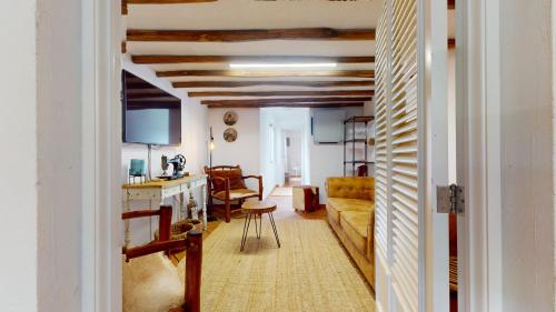 a living room with a couch and a table at Azores Furnas Quinta Do Vale in Furnas