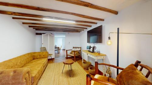 a living room with a couch and a table at Azores Furnas Quinta Do Vale in Furnas