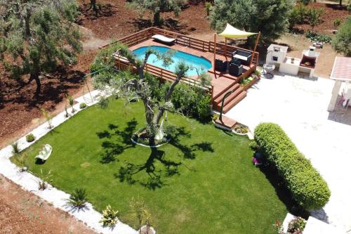 an aerial view of a yard with a swimming pool at villa Antony in San Michele Salentino