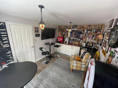 a living room with a couch and a table at The Cubley Retreat in Sheffield