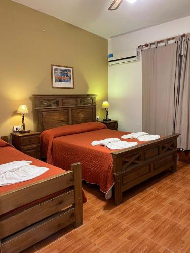 Postel nebo postele na pokoji v ubytování Hotel Gloria