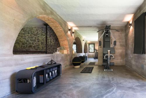 a large room with a gym with a heater in it at Dimora Cottanera in Castiglione di Sicilia
