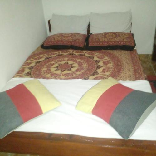 two beds in a room with two bedsskirts at Grace Villa Bentota in Bentota