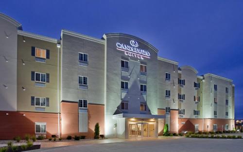 a rendering of the granlund hotel at night at Candlewood Suites Kansas City Northeast by IHG in Kansas City