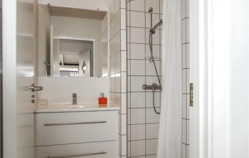 a bathroom with a sink and a shower at Stunning Home In Juelsminde With House Sea View in Juelsminde