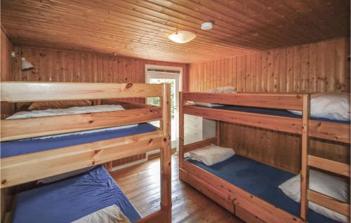 a bedroom with two bunk beds in a cabin at Pet Friendly Home In Grenaa With Wifi in Brøndstrup