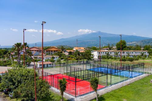 a view of a tennis court in a city at Villaggio Alkantara in Giardini Naxos