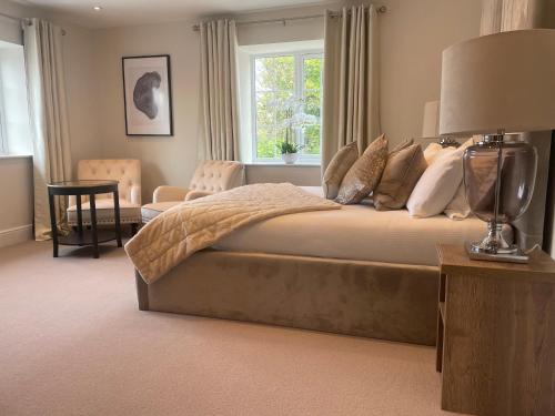 a bedroom with a large bed and a window at The Green Inn in Goole