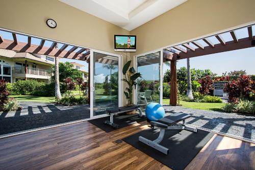an indoor gym with a gym ball and a treadmill at Waikoloa Beach Villas L3 in Waikoloa