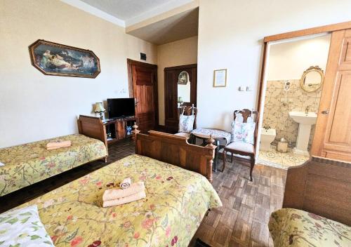 a hotel room with two beds and a bathroom at Willa Bajka in Inowrocław