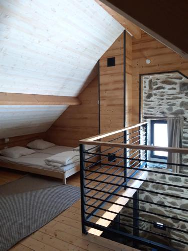 a room with a bunk bed and a staircase at CHALET AULIAN in Grust