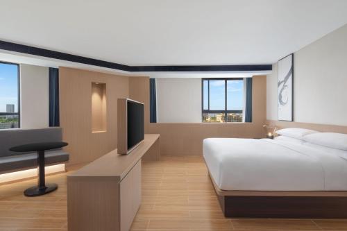 Postel nebo postele na pokoji v ubytování Fairfield by Marriott Kunshan