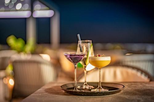 two cocktails on a tray on a table at Geneva Marriott Hotel in Geneva
