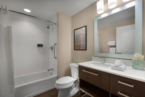 a bathroom with a toilet and a sink and a shower at TownePlace Suites Boone in Boone