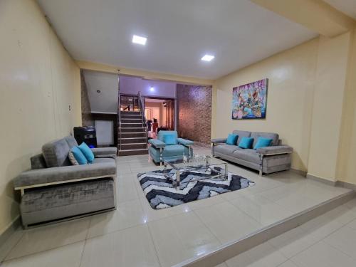 a living room with two couches and a table at Martina House in Iquitos