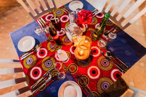 a table with a blue and red table cloth at Golden Tulip Stone Town Boutique in Zanzibar City