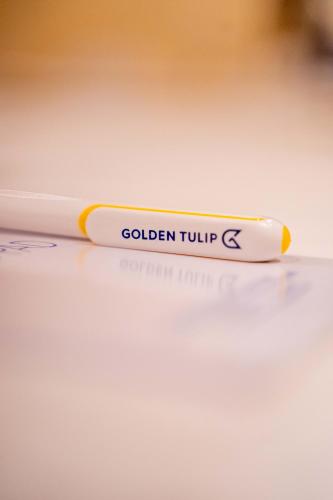 a yellow pencil sitting on top of a table at Golden Tulip Stone Town Boutique in Zanzibar City
