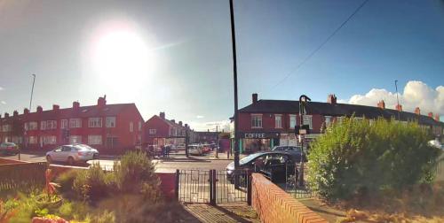 a street with cars parked in a parking lot at Double room in Heaton in Heaton