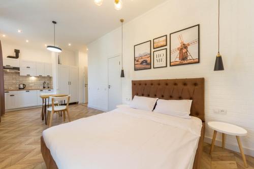 Ένα ή περισσότερα κρεβάτια σε δωμάτιο στο Idea Design Apart-Hotel Chykalenka