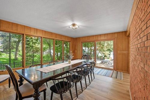 a large dining room with a long table and chairs at Lake Boat Hot Tub Sauna Private Chef in Shoreview