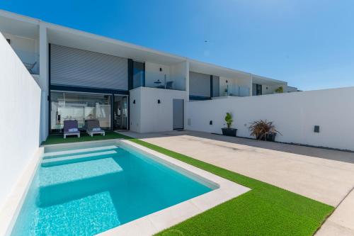 an image of a house with a swimming pool at BmyGuest Collection - Meco Sunset & Pool Villa in Sesimbra