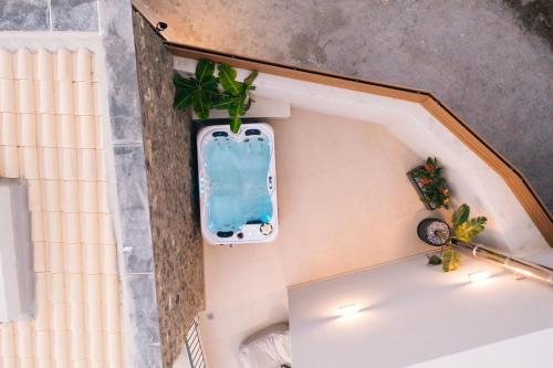 an overhead view of a bath tub in a room at Mirthea Suites in Mírthios