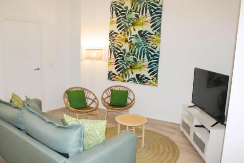 A television and/or entertainment centre at Apartamento reformado en pleno centro histórico
