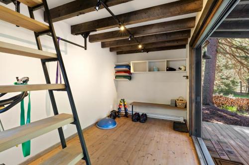 a room with a loft bed and a desk at Slippery Rock River Ranch in Dolores
