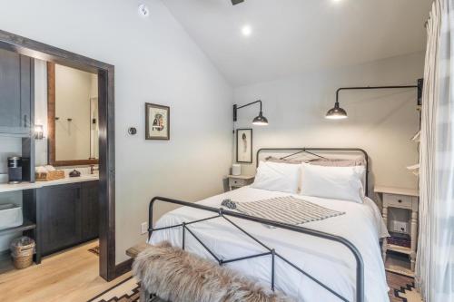 a bedroom with a bed and a mirror at Slippery Rock River Ranch in Dolores