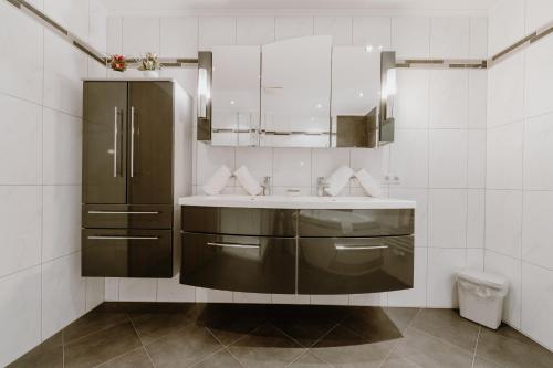 a bathroom with a sink and a mirror at Appartement Sporthütte Fiegl in Sölden
