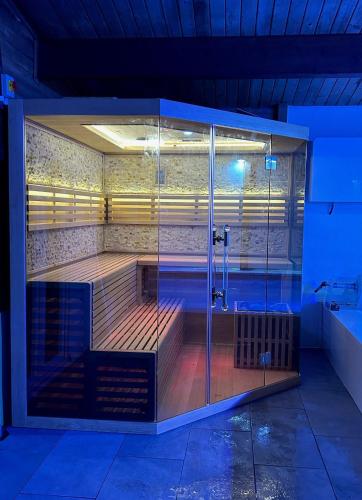 a swimming pool with a shower in a room at Thomas Carlyle Cottage in Thornhill